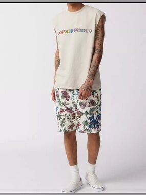 Keith Haring Dancing Icon Muscle
Tee.